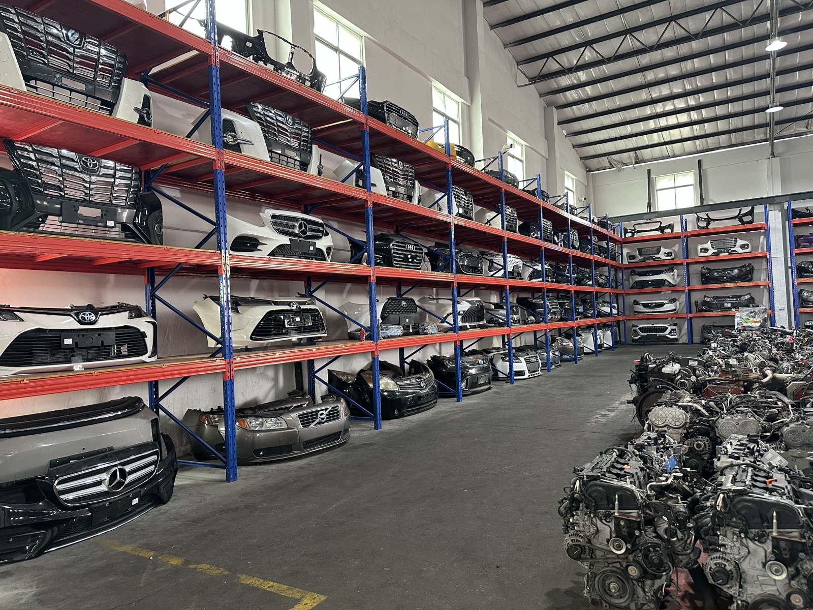 Body panels and bumpers on shelves