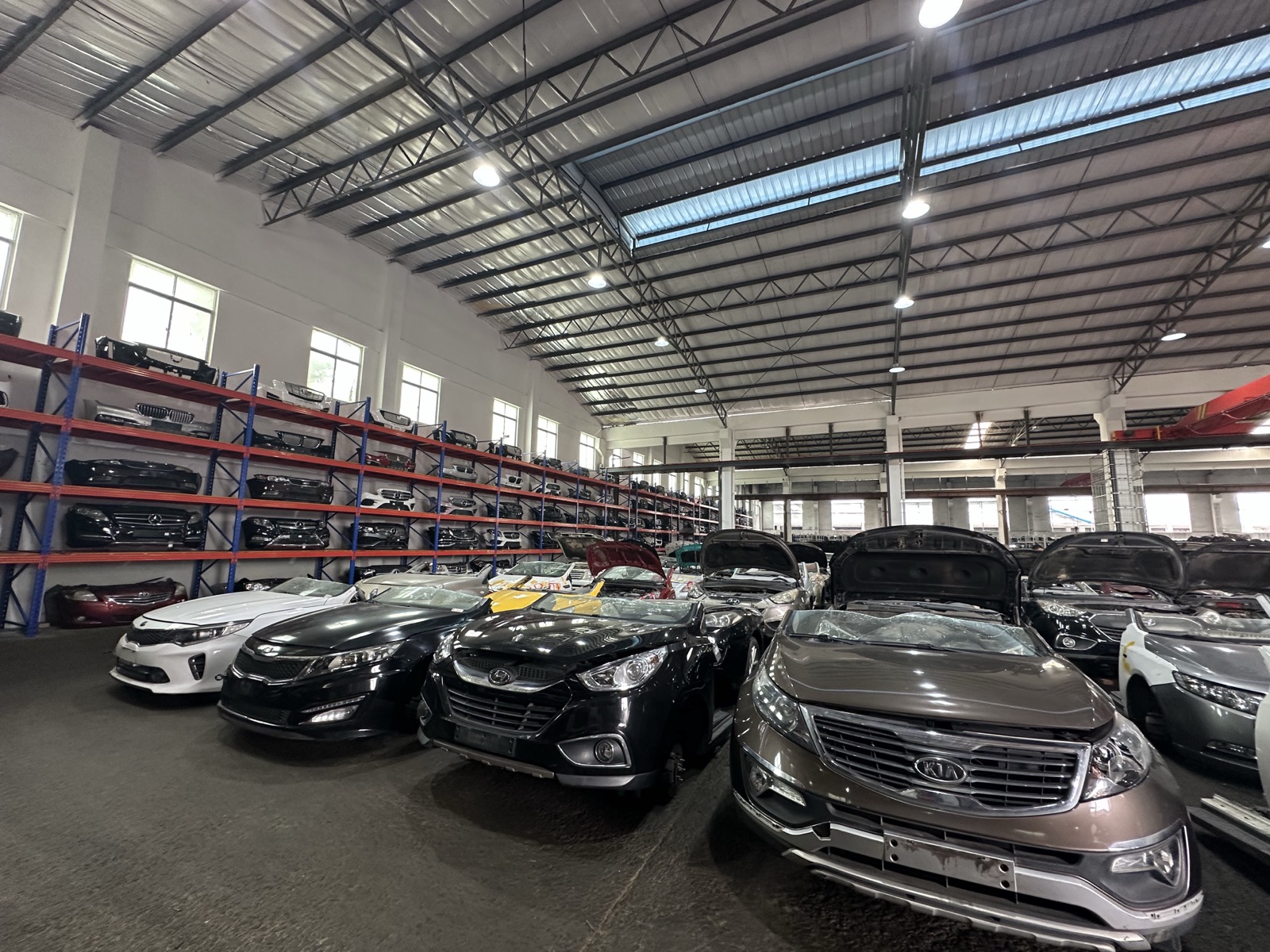 Full warehouse floor with vehicles